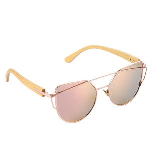 pink cat eye sunglasses with bamboo arms three quarter image