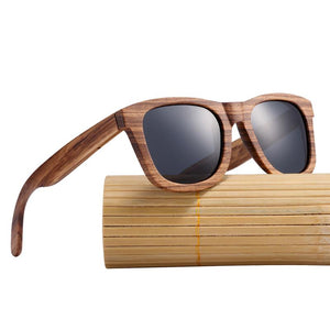 Vintage Natural Zebra Wood Sunglasses with black lenses on a bamboo roll