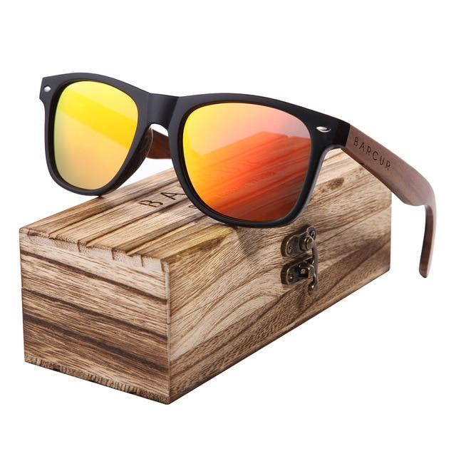 Black walnut sunglasses with orange lenses on top of high quality wooden case