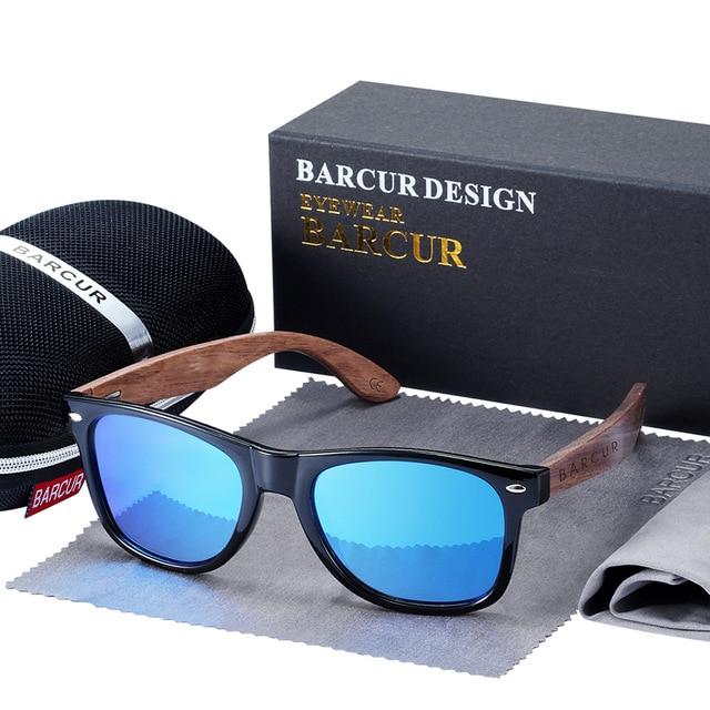Black Walnut sunglasses with blue lenses in front of case, cleaning cloth and pag