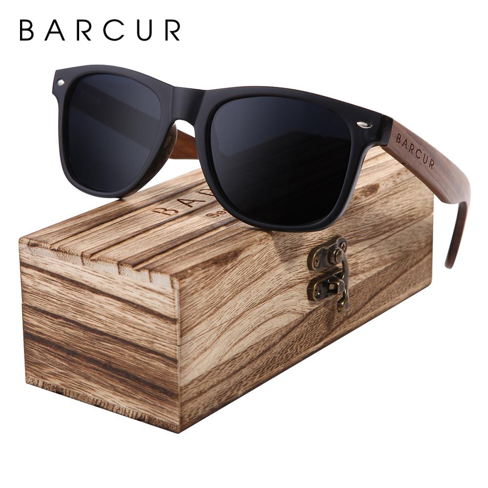 Black walnut sunglasses with black lenses on top of high quality wooden case