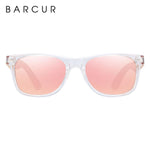 Children's polarized sunglasses with bamboo arms and pink lenses front view