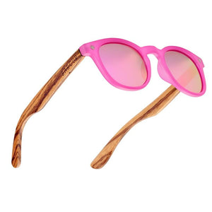 Polarised Kids Round Zebra Wood Sunglasses with pink frames and lenses three quarter view