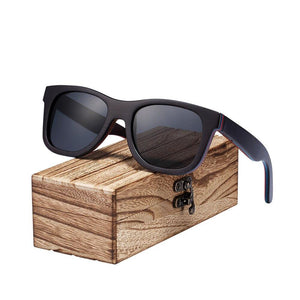 Black skateboard wood sunglasses on wooden case