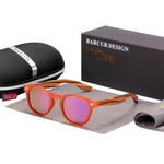 Polarised Kids Round Zebra Wood Sunglasses with pink frames and lenses