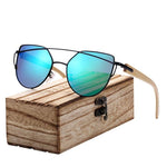 green cat eye sunglasses with bamboo arms and wooden case